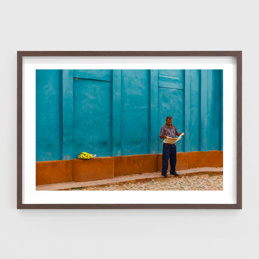 Newspaper reading banana seller